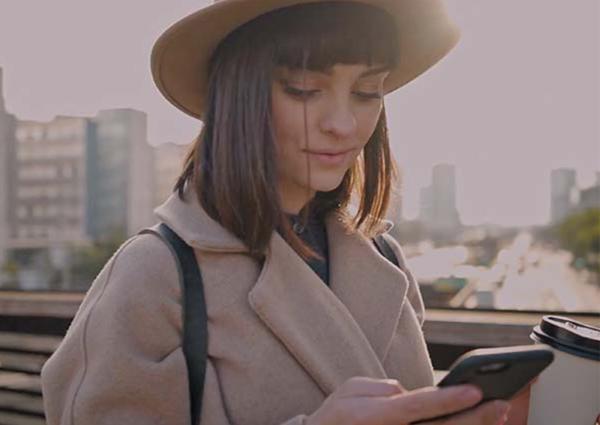 Young women using apps on smartphone