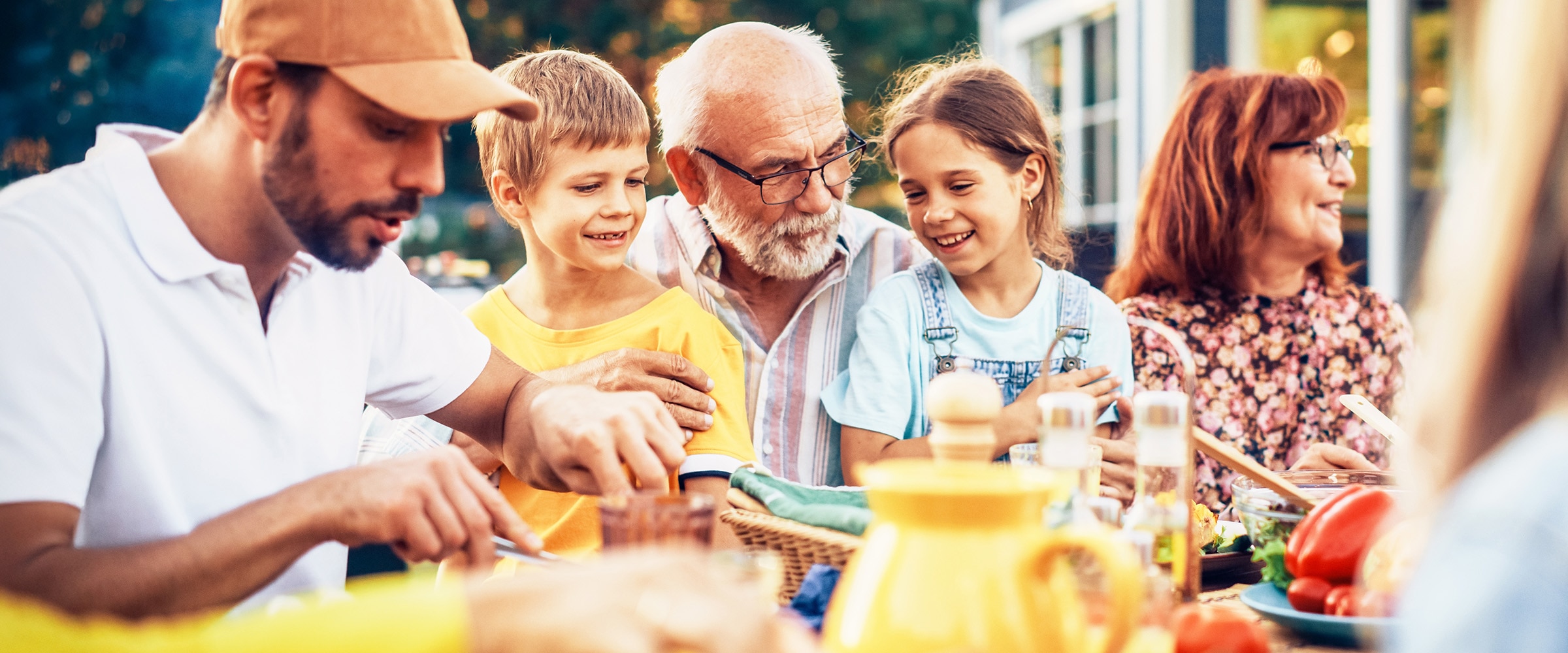 Photo of the generations of a family sitting at a table.