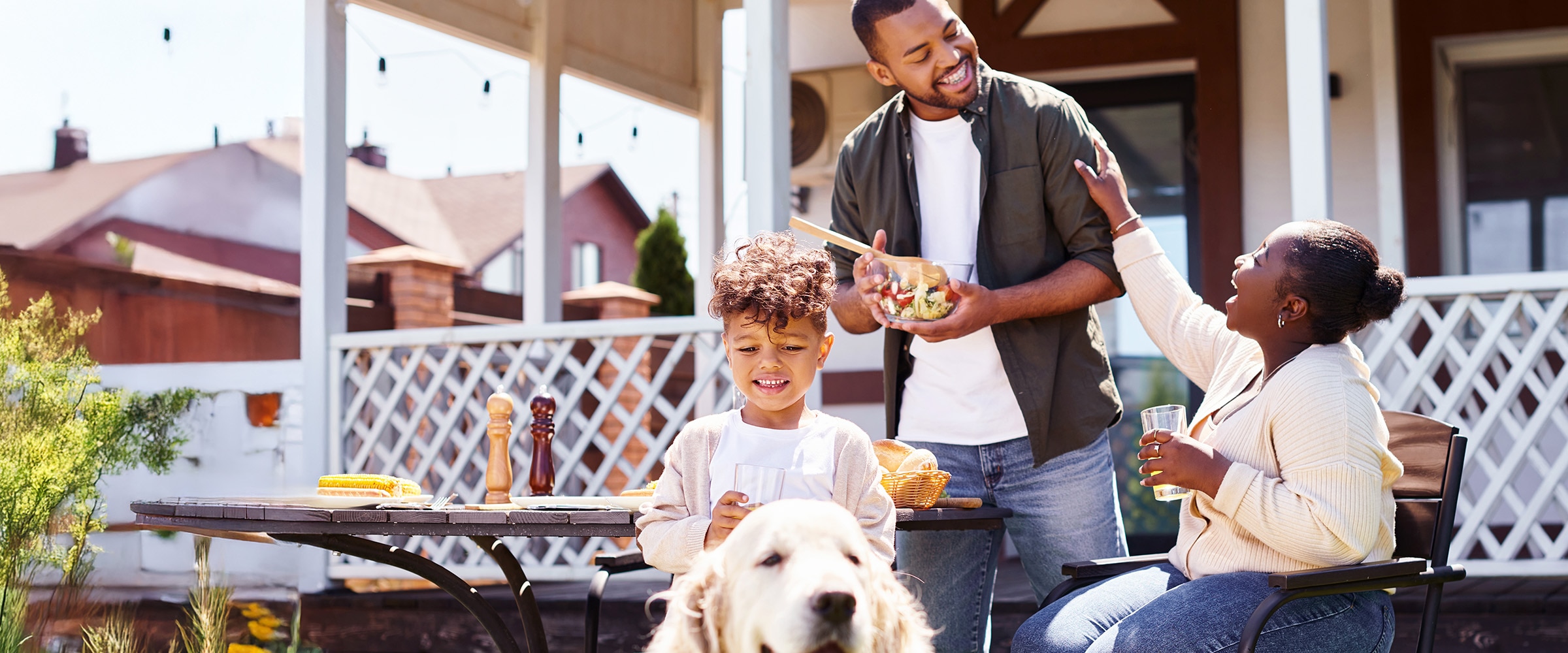 Photo of African American family in front of home.