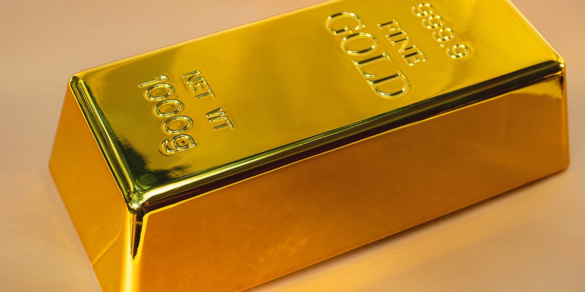 One gold brick on tan background.